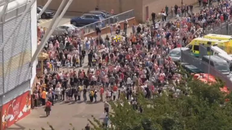 Fans queue to enter the stadium ahead of Southampton&#39;s match against Manchester United