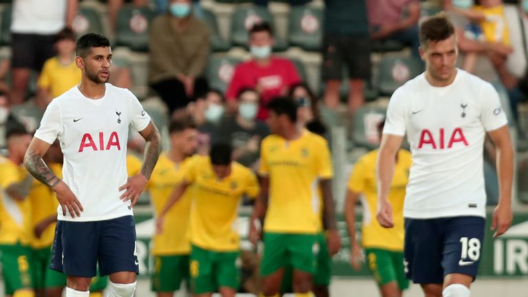 Tottenham's Cristian Romero and Giovani Lo Celso, right, react after Pacos de Ferreira score the opening goal