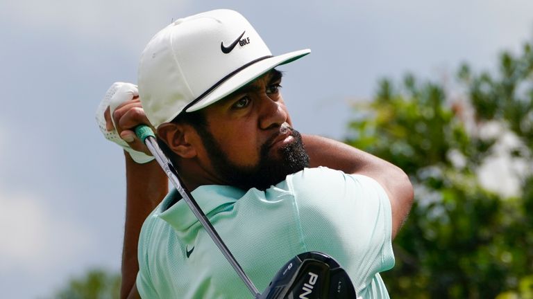 Tony Finau tees off on the third hole in the final round at The Northern Trust golf tournament at Liberty National Golf Course Monday, Aug. 23, 2021, in Jersey City, N.J. (AP Photo/John Minchillo)