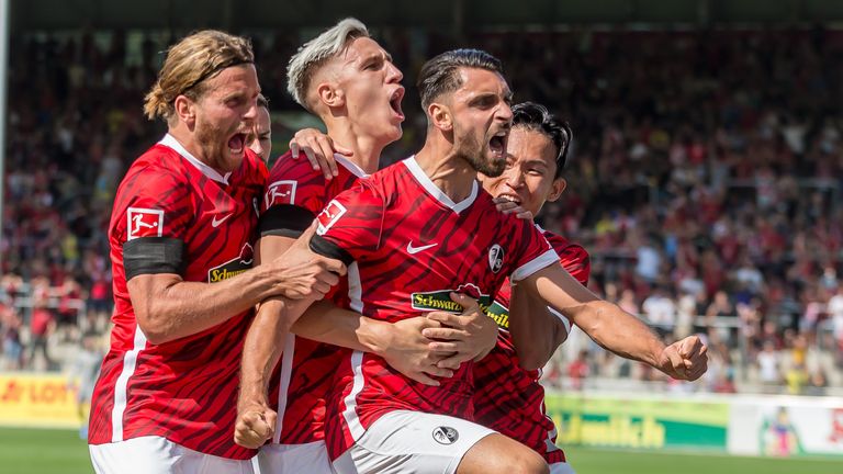 Vincenzo Grifo of Freiburg celebrates after scoring his team&#39;s first goal with teammates