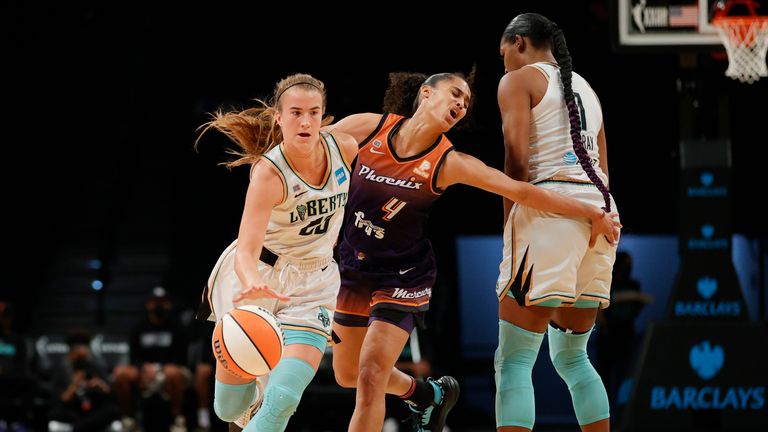 Sabrina Ionescu #20 of the New York Liberty dribbles as Skylar Diggins-Smith #4 of the Phoenix Mercury defends during the first half at Barclays Center on August 25, 2021 in the Brooklyn borough of New York City.