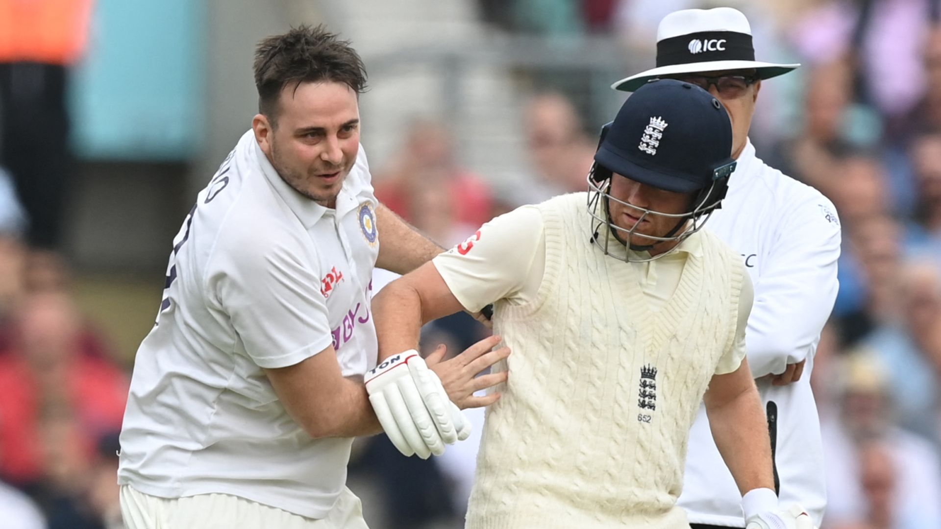 Pitch invader arrested after collision with Bairstow