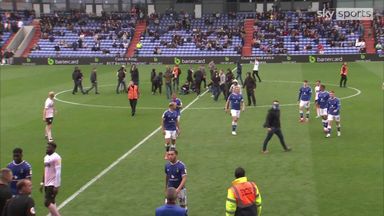 Oldham game delayed as fans stage on-pitch protest