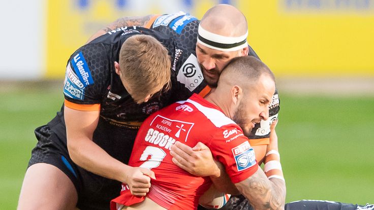 Picture by Allan McKenzie/SWpix.com - 17/05/2021 - Rugby League - Betfred Super League Round 6 - Castleford Tigers v Hull KR - the Mend A Hose Jungle, Castleford, England - Hull KR's Ben Crooks is tackled by Castleford's Michael Shenton & George Griffin..