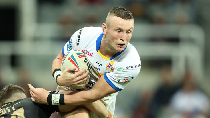 Picture by John Clifton/SWpix.com - 04/09/2021 - Rugby League - Dacia Magic Weekend 2021 - Leeds Rhinos v Hull FC - St. James's Park, Newcastle, England - Leeds Rhinos' Harry Newman in action with Hull FC's Cameron Scott