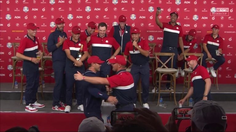 Bryson DeChambeau and Brooks Koepka put their rivalry aside to embrace with the Ryder Cup trophy after Team USA's record victory at Whistling Straits