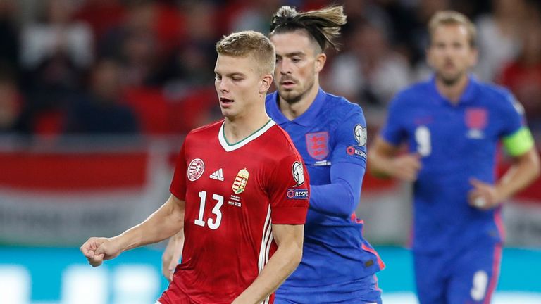 Hungary's Andras Schaefer is chased by Jack Grealish