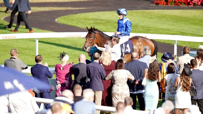 William Buick and Anmaat return to winner's enclosure at Doncaster
