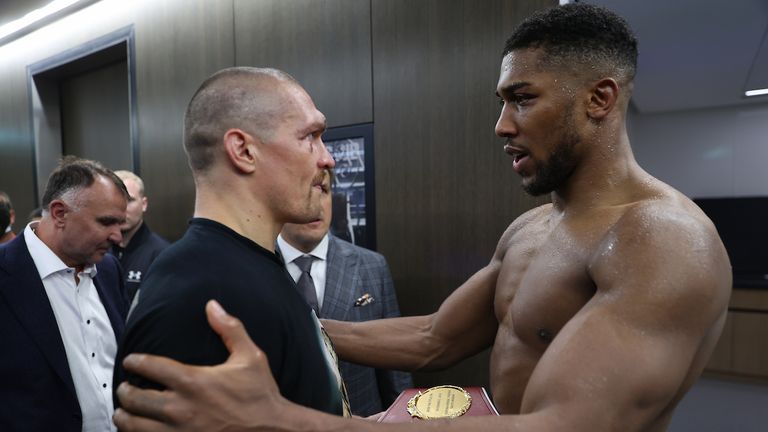 Anthony Joshua vs Oleksander Usyk, IBF, WBA, WBO and IBO Heavyweight World Title, Tottenham Hotspur Stadium, London..25 September 2021.Picture By Mark Robinson Matchroom Boxing..Anthony Joshua and Oleksander Usyk meet backstage after their contest. 