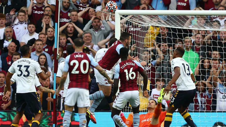 Asmir Begovic makes a save from a Tyrone Mings header