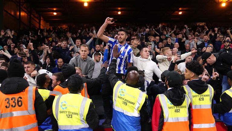 Brighton fans celebrate their dramatic draw