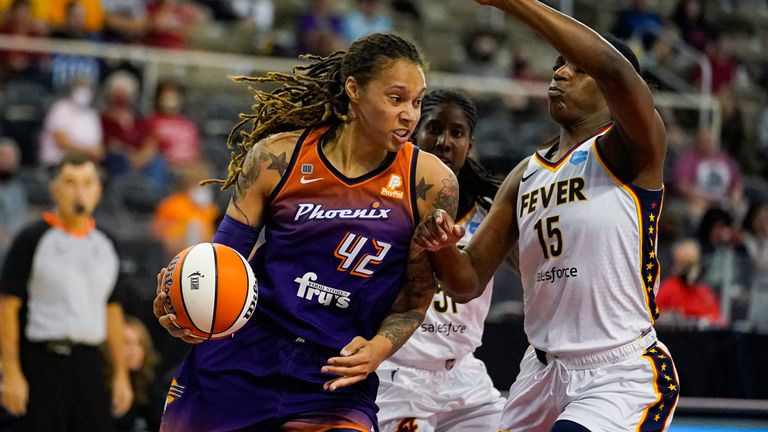 Phoenix Mercury center Brittney Griner (42) drives on Indiana Fever forward Jessica Breland (51) in the first half of a WNBA basketball game in Indianapolis, Monday, Sept. 6, 2021. (AP Photo/Michael Conroy)