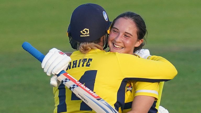 Alice Capsey (R) embraces South East Stars team-mate Kirstie White after hitting the winning runs to win the inaugural Charlotte Edwards Cup against Northern Diamonds in 2021