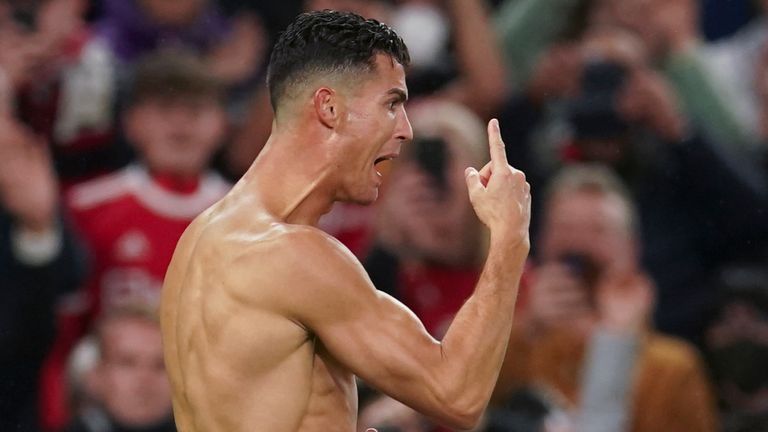 Manchester United's Cristiano Ronaldo, left, celebrates with teammate Diogo Dalot after scoring the match winning goal during the Champions League Group F soccer match between Manchester United and Villarreal at Old Trafford, Manchester, England, Wednesday, Sept. 29, 2021. (AP Photo/Dave Thompson)