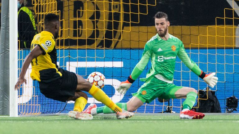 Young Boys' Jordan Pefok, left, scores his side's second goal of the game past Manchester United's goalkeeper David de Gea