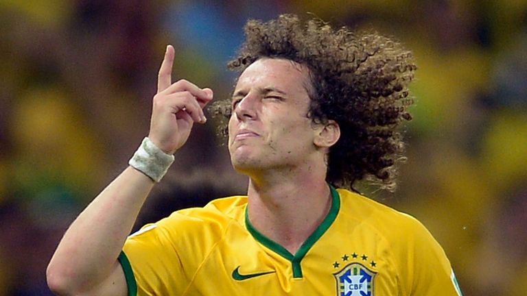AP - Brazil's David Luiz celebrates after he scored his side's second goal during the World Cup quarterfinal soccer match between Brazil and Colombia at the Arena Castelao in Fortaleza, Brazil, Friday, July 4, 2014.  (AP Photo/Manu Fernandez)