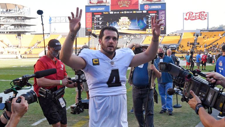 Las Vegas Raiders quarterback Derek Carr waves to fans as he heads to the locker room following a victory over the Pittsburgh Steelers