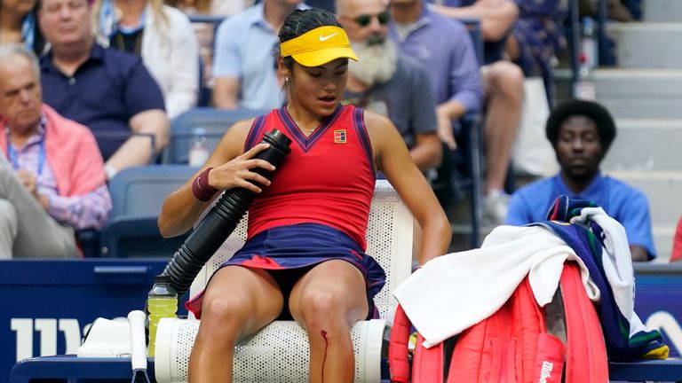 Raducanu overcame a cut to her knee when serving for the match to claim her mainden major (AP Photo/Seth Wenig) 