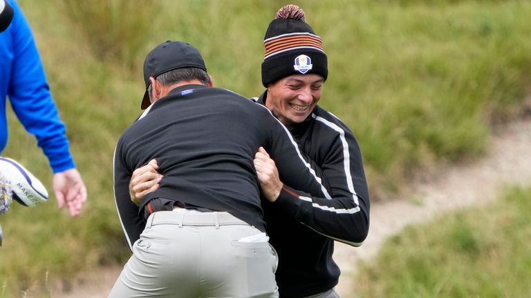 Team Europe's Viktor Hovland and Team Europe's Paul Casey have some fun on the ninth hole during a practice day at the Ryder Cup at the Whistling Straits Golf Course Thursday, Sept. 23, 2021, in Sheboygan, Wis. (AP Photo/Ashley Landis)