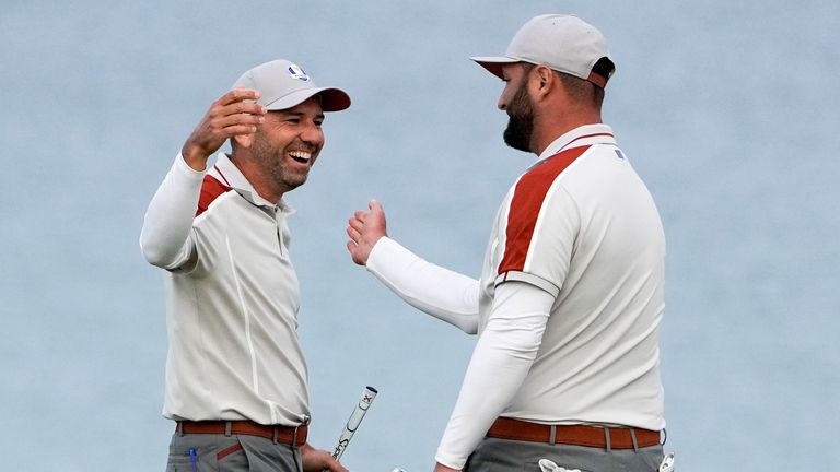 Team Europe's Sergio Garcia and Team Europe's Jon Rahm celebrate on the 16th hole during a four-ball match the Ryder Cup at the Whistling Straits Golf Course Saturday, Sept. 25, 2021, in Sheboygan, Wis. (AP Photo/Jeff Roberson)