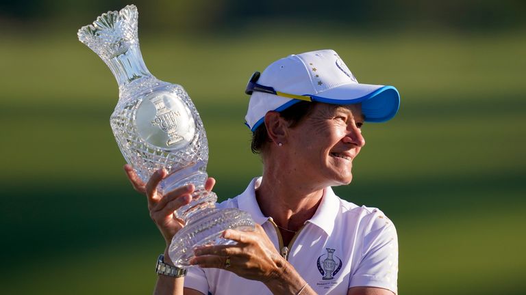 Europe Captain, Catriona Matthew holds up the trophy after defeating the United States at the Solheim Cup