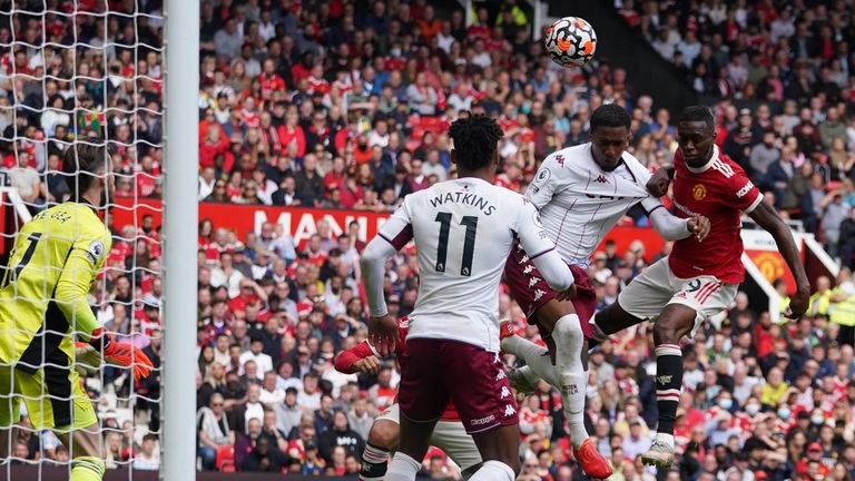 Aston Villa's Ezri Konza heads over the bar