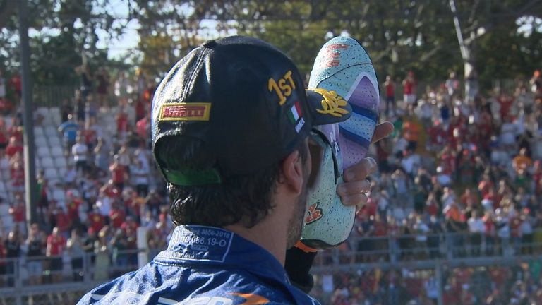 After winning the Italian Grand Prix, Ricciardo celebrates by doing his traditional 'shoey' celebration