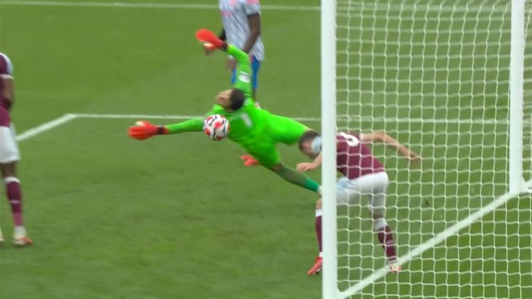 Lukas Fabianski saves from Bruno Fernandes in West Ham's clash with Manchester United.