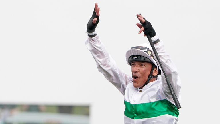 Frankie Dettori performs his famous flying dismount after victory on Free Wind at Doncaster
