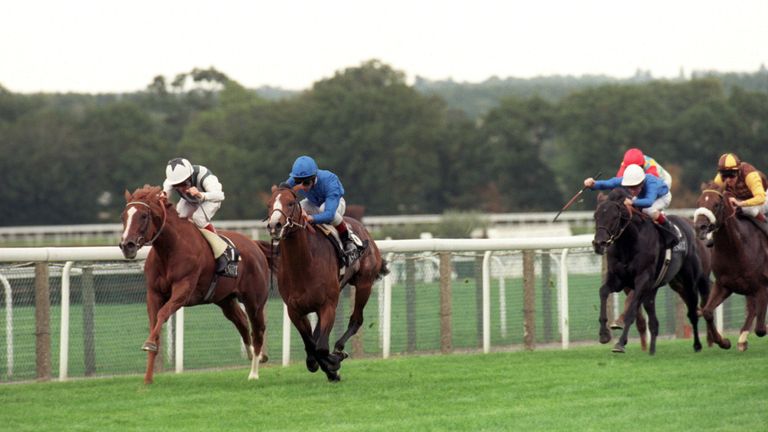 Mark of Esteem (all blue) wins the QEII from Bosra Sham and Pat Eddery