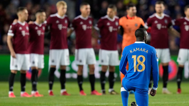 Glen Kamara takes a knee in front of Sparta Prague players