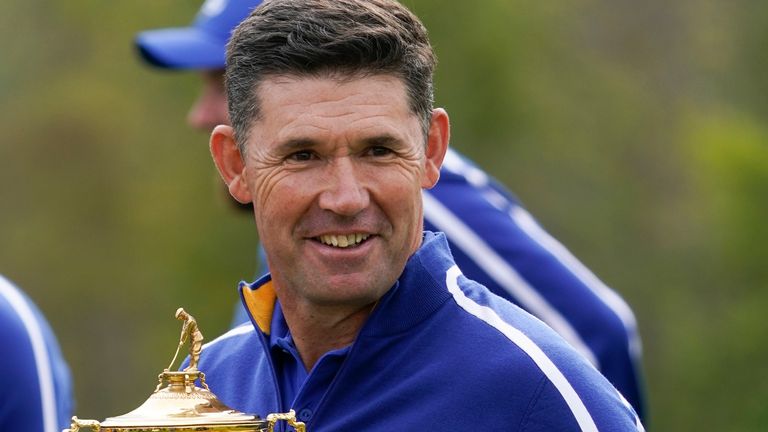 Team Europe captain Padraig Harrington holds the trophy as they pose for a team picture during a practice day at the Ryder Cup at the Whistling Straits Golf Course Tuesday, Sept. 21, 2021, in Sheboygan, Wis. (AP Photo/Charlie Neibergall)