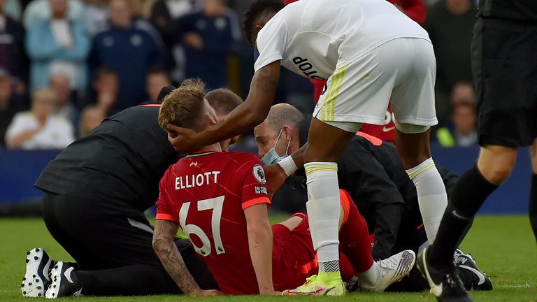Harvey Elliott is consoled on the pitch