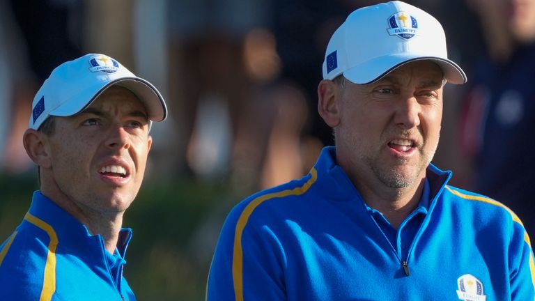 Team Europe's Rory McIlroy and Team Europe's Ian Poulter look over a shot on the second hole during a foursome match the Ryder Cup at the Whistling Straits Golf Course Friday, Sept. 24, 2021, in Sheboygan, Wis. (AP Photo/Charlie Neibergall)