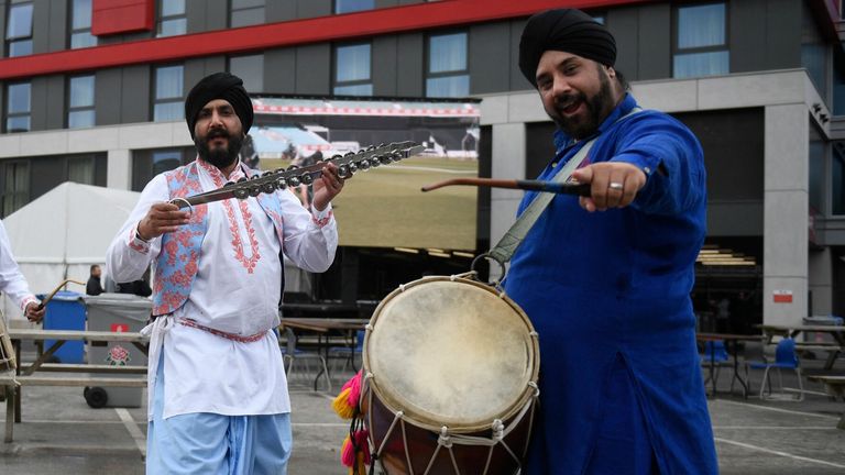 A bhangra band poses following news of the cancellation of the fifth cricket Test match between England and India at Old Trafford cricket ground in Manchester, north-west England on September 10, 2021.