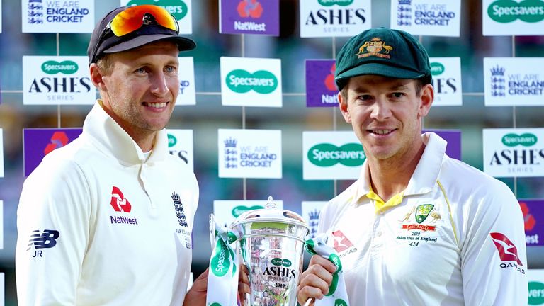 England Captain Joe Root (left) and Australia Captain Tim Paine hold the trophy on stage during the final presentation at the end of day four of the fifth test match at The Kia Oval, London.