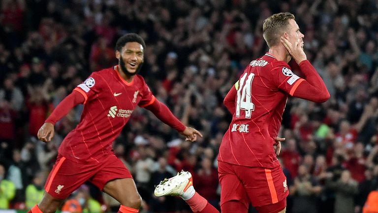 Liverpool's Jordan Henderson celebrates after scoring against AC Milan