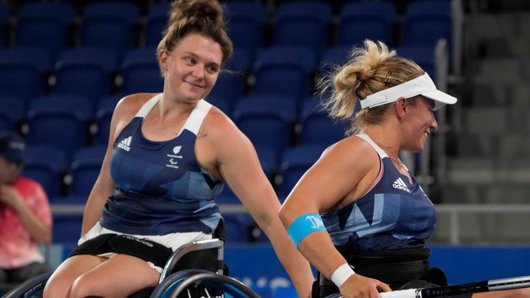 Britain's Jordanne Whiley, left, and Lucy Shuker celebrates after defeating South Africa's Kgothatso Montjane and Mariska Venter in a women's doubles quarterfinal tennis match at the Tokyo 2020 Paralympic Games, Sunday, Aug. 29, 2021, in Tokyo, Japan. (AP Photo/Kiichiro Sato)