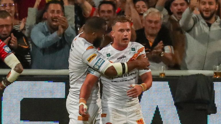 Picture by Manuel Blondeau/SWpix.com - 30/09/2021 - Rugby League - Betfred Super League Semi Final - Catalans Dragons v Hull KR - Stade Gilbert Brutus, Perpignan, France - Josh Drinkwater of Dragons Catalans is congratulated by Samisonie Langi of Dragons Catalans after scoring a try