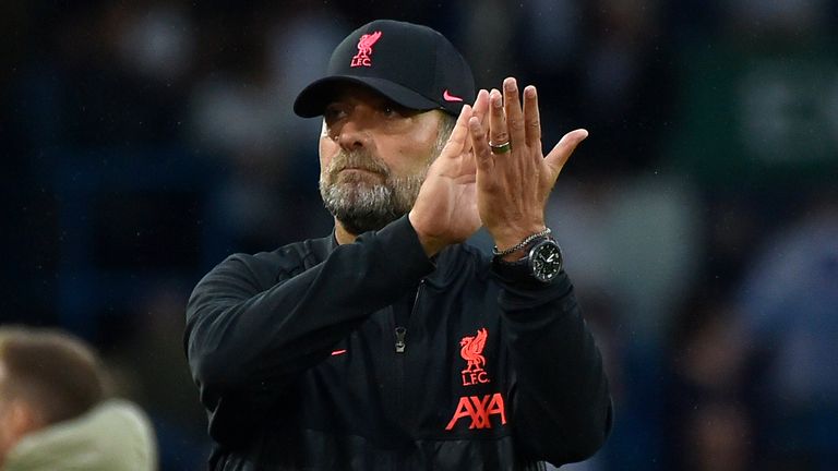 Jurgen Klopp applauds the Liverpool supporters