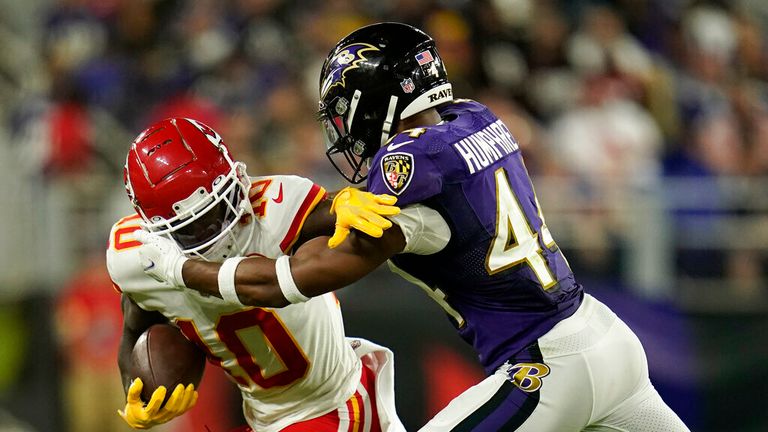 Kansas City Chiefs wide receiver Tyreek Hill, left, rushes against Baltimore Ravens cornerback Marlon Humphrey in the second half of an NFL football game, Sunday, Sept. 19, 2021, in Baltimore. (AP Photo/Julio Cortez)