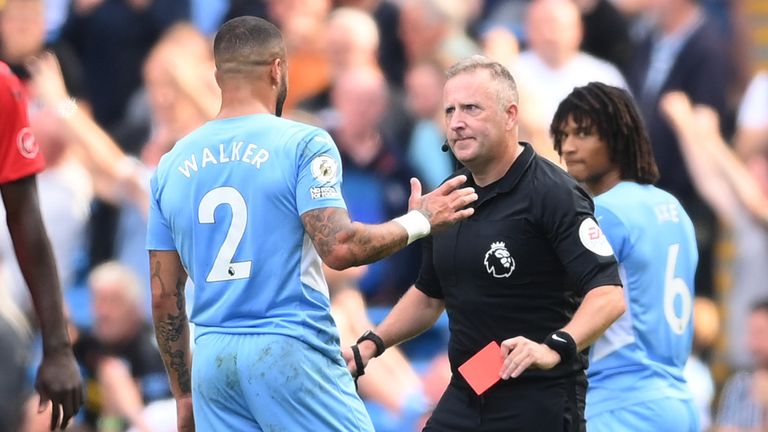 Referee Jonathan Moss shows Kyle Walker a red card which he later overturns following a VAR review