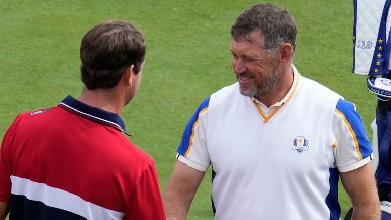 Team Europe's Lee Westwood shakes hand with Team USA's Harris English on the first tee during a Ryder Cup singles match at the Whistling Straits Golf Course Sunday, Sept. 26, 2021, in Sheboygan, Wis. (AP Photo/Ashley Landis)