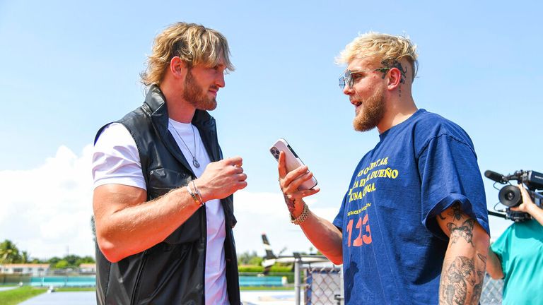 Media personality Logan Paul (left) and brother Jake Paul (right) during a media face-off event on Thursday, May 6, 2021 in Miami Gardens, Fla. (Carlos Goldman/Miami Dolphins via AP)