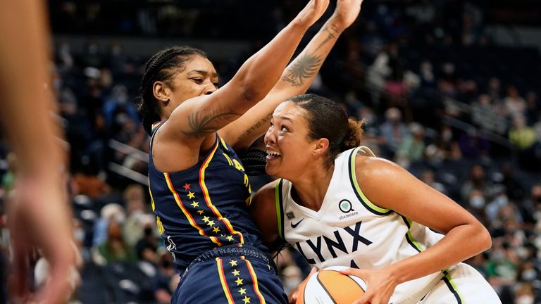 Minnesota Lynx forward Napheesa Collier (24) drives to the basket while defended by Indiana Fever guard Victoria Vivians (35) during the first quarter of a WNBA basketball game, Sunday, Sept. 12, 2021, in Minneapolis. 