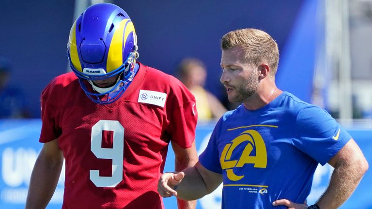 Los Angeles Rams head coach Sean McVay, talks to quarterback Matthew Stafford during an NFL football camp practice Wednesday, July 28, 2021, in Irvine, Calif. (AP Photo/Marcio Jose Sanchez)