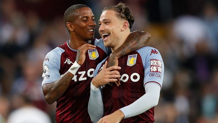 Matty Cash celebrates Villa's win with Ashley Young