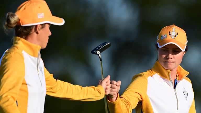 Europe's Leona Maguire and Mel Reid celebrate after a putting on the fifth hole during the foursome matches at the Solheim Cup golf tournament, Sunday, Sept. 5, 2021, in Toledo, Ohio. (AP Photo/David Dermer).
