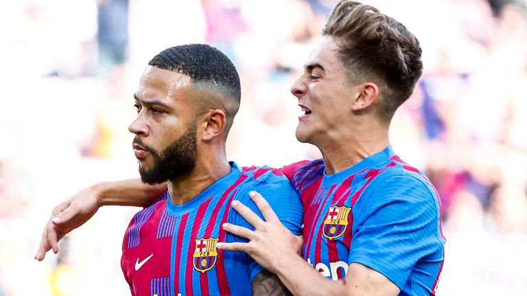 Depay celebrates after scoring a first-half penalty