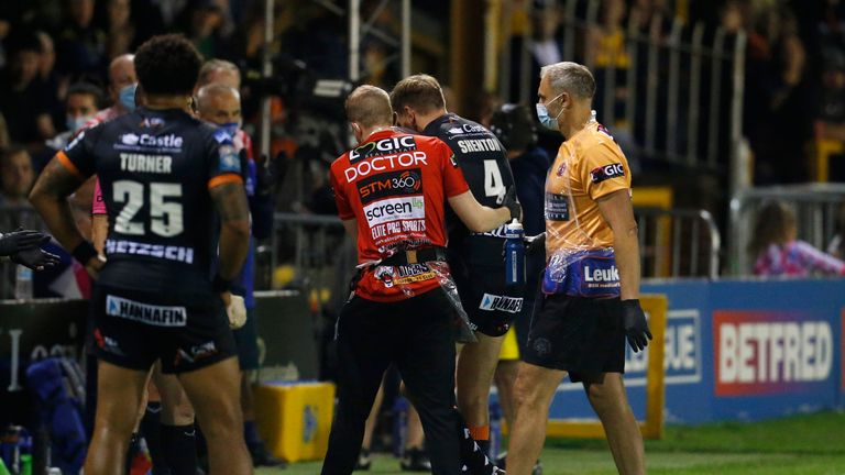 Castleford captain Michael Shenton leaves the pitch after sustaining an injury